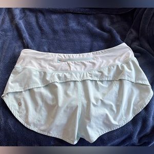 teal/mint color lululemon speed ups 2.5 inch seam size 8